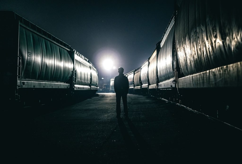 man standing in dark 