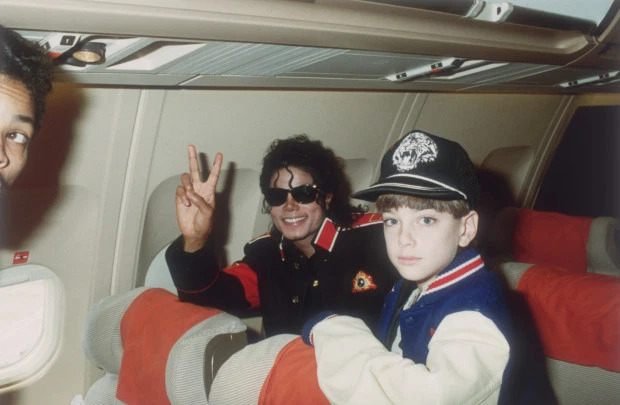 Michael Jackson with 10 year old James "Jimmy" Safechuck on the tour plane