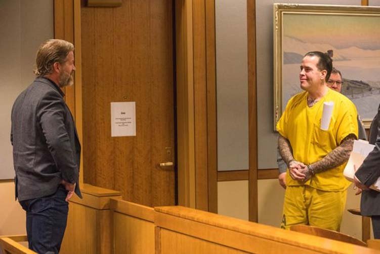 Joel Fulton(left) smiles at this brother Jason Vukovich during Vukovich's sentencing hearing