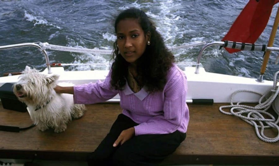 Joyce Vincent with her dog on a boat in the sea